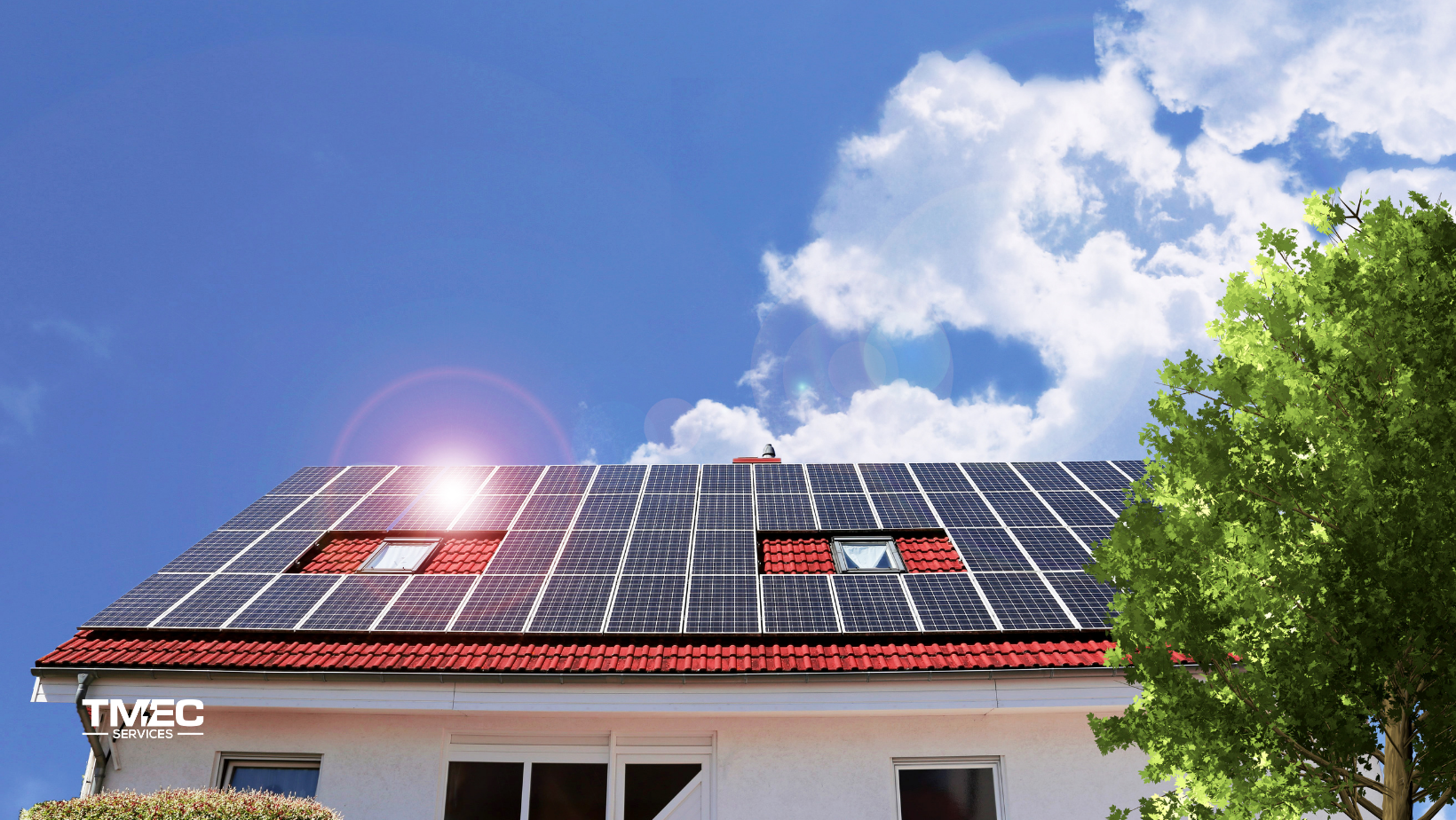 Modern home with a red-tiled roof fitted with solar panels under clear blue skies on the Sunshine Coast. TMEC Services – trusted solar panel installer – showcasing efficient solar panel installation for long-term energy savings.